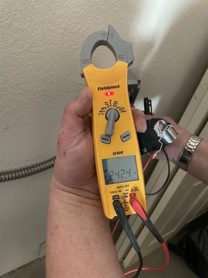 Voltage testing with clamp meter during Recessed Lighting Installation in Brimfield
